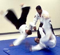 Sensei Earl Layumas demonstrating Pivot Take Down to 2 Uke